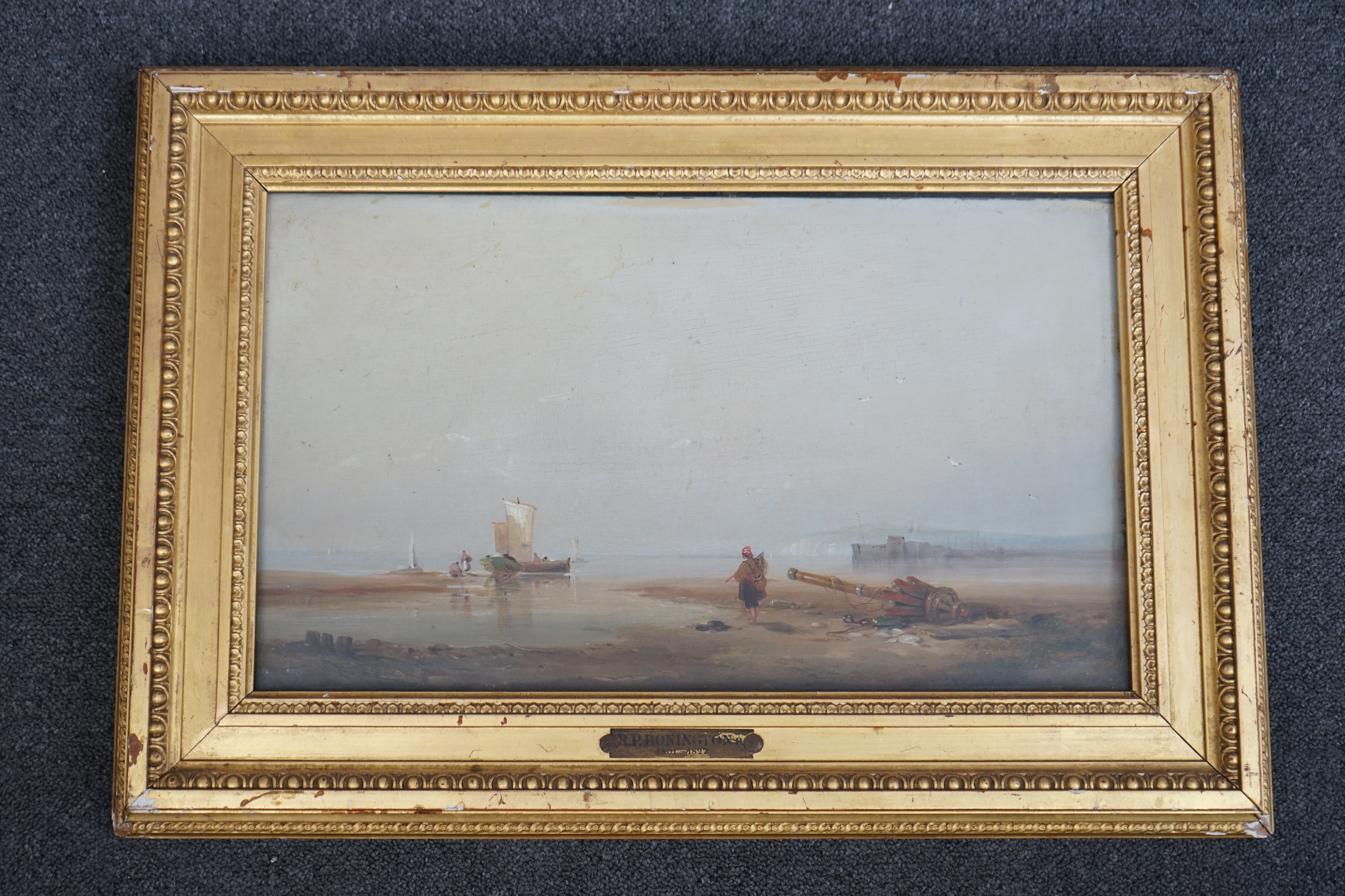 Circle of Richard Parkes Bonington (English, 1802–1828), Fisherfolk on the shore at low tide, oil on wooden panel, 28 x 46cm